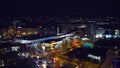 VIENNA, AUSTRIA - DECEMBER, 24 Illuminated urban railroad station and moving trains at night, aerial view