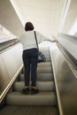 Vienna, Austria. Girl tourist on the steps of the escalator.