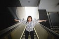 Vienna, Austria. Girl tourist on the steps of the escalator.