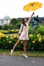 VIENNA, AUSTRIA. A girl with a yellow umbrella on the background of the Neue Burg, a new castle of the Hofburg P Royalty Free Stock Photo