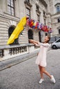 VIENNA, AUSTRIA. A girl with a yellow umbrella on the background of the Neue Burg, a new castle of the Hofburg P Royalty Free Stock Photo