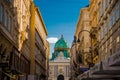 Vienna, Austria: Hofburg palace and panoramic square view, people walking and fiaker with white horses in Vienna, Austria Royalty Free Stock Photo