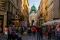 Vienna, Austria: Hofburg palace and panoramic square view, people walking and fiaker with white horses in Vienna, Austria Royalty Free Stock Photo