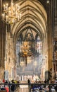 Inside view of Stephansdom St Stephan`s Cathedral. Church full of tourists during a mass. Royalty Free Stock Photo