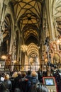 Inside view of Stephansdom St Stephan`s Cathedral. Church full of tourists during a mass. Royalty Free Stock Photo