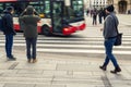 Vienna, Austria - January 15th,2019:Tourists pedestrians at crosswalk waiting bus passing road. Travel lifestyle scene