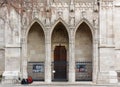 Two Girls in front of an Entrance of the Votive Church in Vienna