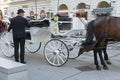 Vienna / Austria - 31 July 2019: Driver waiting in vienna, Austria with the baroque carriage vehicle with horses for a historic Royalty Free Stock Photo