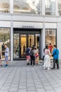 Vienna , Austria - July 7, 2023: Famous Chanel boutique on Tuchlauben street in center of Vienna with people waiting in a queue