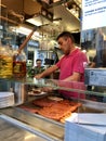 A man slices, arranges Vienna sausage at Zum goldenen Wuerstel sausage stand in Vienna, Austria Royalty Free Stock Photo