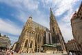 People walking outside Saint Stephen`s Cathedral, called Stephansdom church in Vienna, Austria