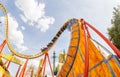 Super wide view of a colorful roller coaster in Prater amusement park at Vienna. Austria