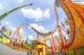 Super wide view of a colorful roller coaster in Prater amusement park at Vienna. Austria