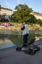 A fisherman catches fish on the Danube Canal embankment in Vienna