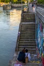 Lovers on the stairs on the Danube Canal Embankment in Vienna