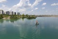 A man is sailing on a boat on Lake Asperner in Vienna