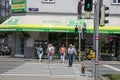 People cross the road at a green traffic light