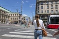 VIENNA, AUSTRIA - JUNE 13, 2023: People cross the street at a pedestrian crossing