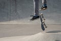 Legs of a skateboarder jumping with his skateboard in midair Royalty Free Stock Photo