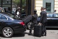 Bellboy taking baggage of guest