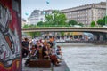 VIENNA, AUSTRIA - MAY 25: Many people are relaxing with alcohol drinks on a day off in a beautiful summer weather on the banks of