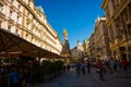 VIENNA, AUSTRIA : memorial Plague column Pestsaule and tourists on Graben street Vienna. The Graben is one of the most famous