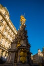 VIENNA, AUSTRIA : memorial Plague column Pestsaule and tourists on Graben street Vienna. The Graben is one of the most famous