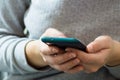 Vienna / Austria / November 14, 2020: Frontal view of womanÃ¢â¬â¢s hands using the smartphone Royalty Free Stock Photo