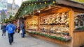 People buy Christmas baubles, toys and souvenirs at traditional Christmas market in front of