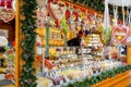 People buy Christmas baubles, toys and souvenirs at traditional Christmas market in front of