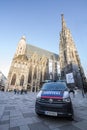 Austrian police car from the Bundespolizei, or polizei, patrolling and guarding Stephansplatz and the Domkirche catholic cathedral