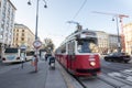 Vienna tram, also called strassenbahn, leaving a tram station at high speed with a motion and movement blur