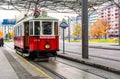 Red retro tram Red retro tram `Vienna Ring Tram` at train station in Vienna
