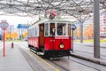 Red retro tram `Vienna Ring Tram` at train station in Vienna