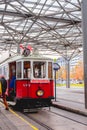 Red retro tram `Vienna Ring Tram` at train station in Vienna