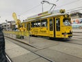 A yellow traditional Vienna Ring Tram in Vienna, Austria.