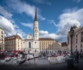 Saint Michael Square Michaelerplatz with Saint Michael Church and Horse-drawn carriages fiakers - Vienna, Austria