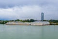 Bertha-von-Suttner-Gymnasium on Danube river and Floridotower in the distance, Vienna,