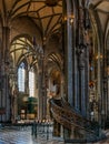 Interior view of a pulpit and side nave in the ostentatious St. Stephen`s Cathedral in Vienna