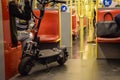 Vienna, Austria - September , 16, 2019: People, a motorized scooter and dogs are passengers inside a Vienna subway car