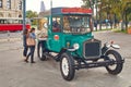 Vienna, Austria - September 22, 2014: Tourists near movable gingerbread and candy shop in the form of a vintage car on