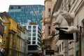 Vienna, Austria: An unusual Sculpture on the house: the white hands of a magician, a hat and a rabbit