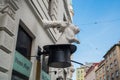 Vienna, Austria: An unusual Sculpture on the house: the white hands of a magician, a hat and a rabbit