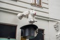 Vienna, Austria: An unusual Sculpture on the house: the white hands of a magician, a hat and a rabbit