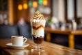 Vienna coffee with whipped cream and chocolate in elegant glass and cup of espresso on wooden table Royalty Free Stock Photo