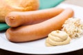Vienna sausages with a roll, horseradish and mustard on a plate Royalty Free Stock Photo