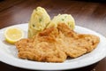 Vienna schnitzel with mashed potatoes and baby onion Royalty Free Stock Photo