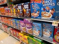 Huge selection of various brands of breakfast cereal at a grocery store aisle