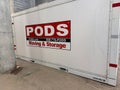 A PODS storage and moving container placed at a loading dock in an apartment building Royalty Free Stock Photo