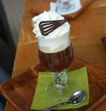 Viennese coffee with whipped cream on glass cup